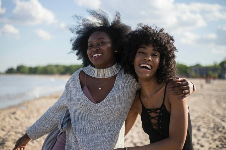 Two black women having fun with their hair out
