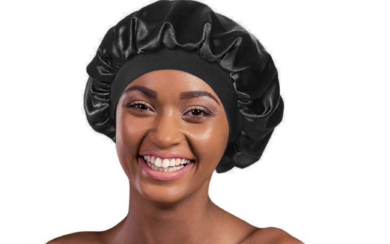 A person wearing a black round hair cover, namely a bonnet.
