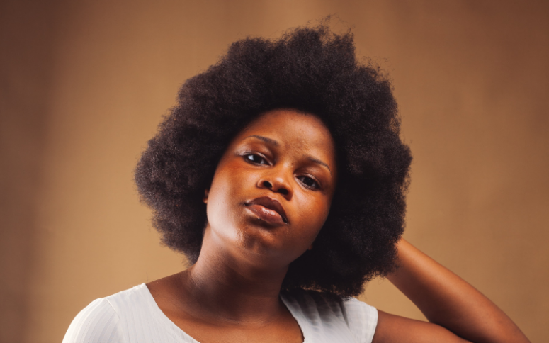 A lady with her afro hair combed out