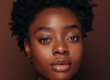 Woman with a short natural hair.